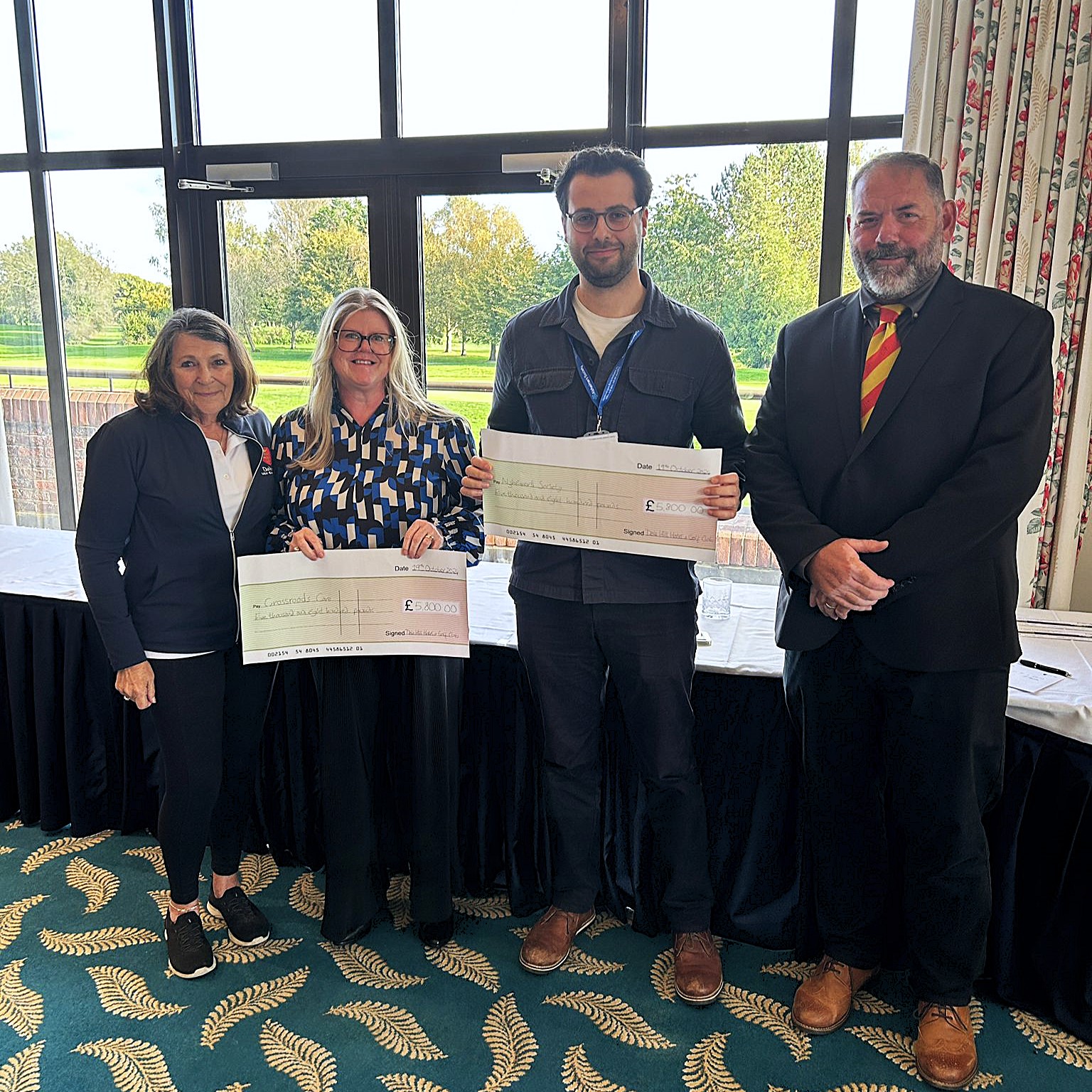 Dale Hill Golf Club Captains presenting a fundraising cheque
